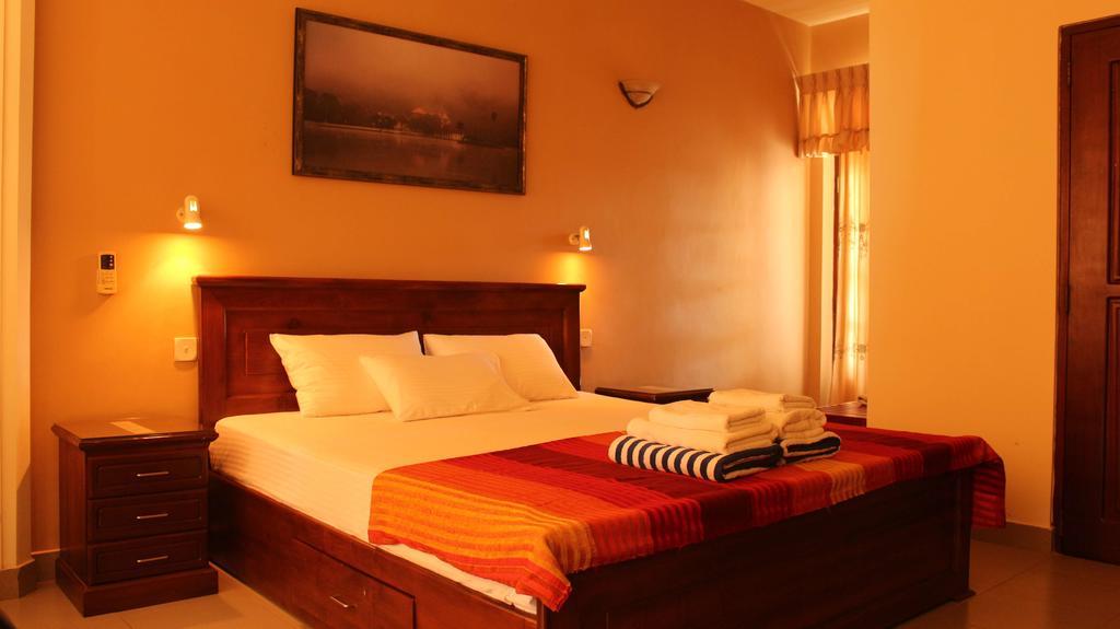 Janishi Residencies Hotel Negombo Quarto foto
